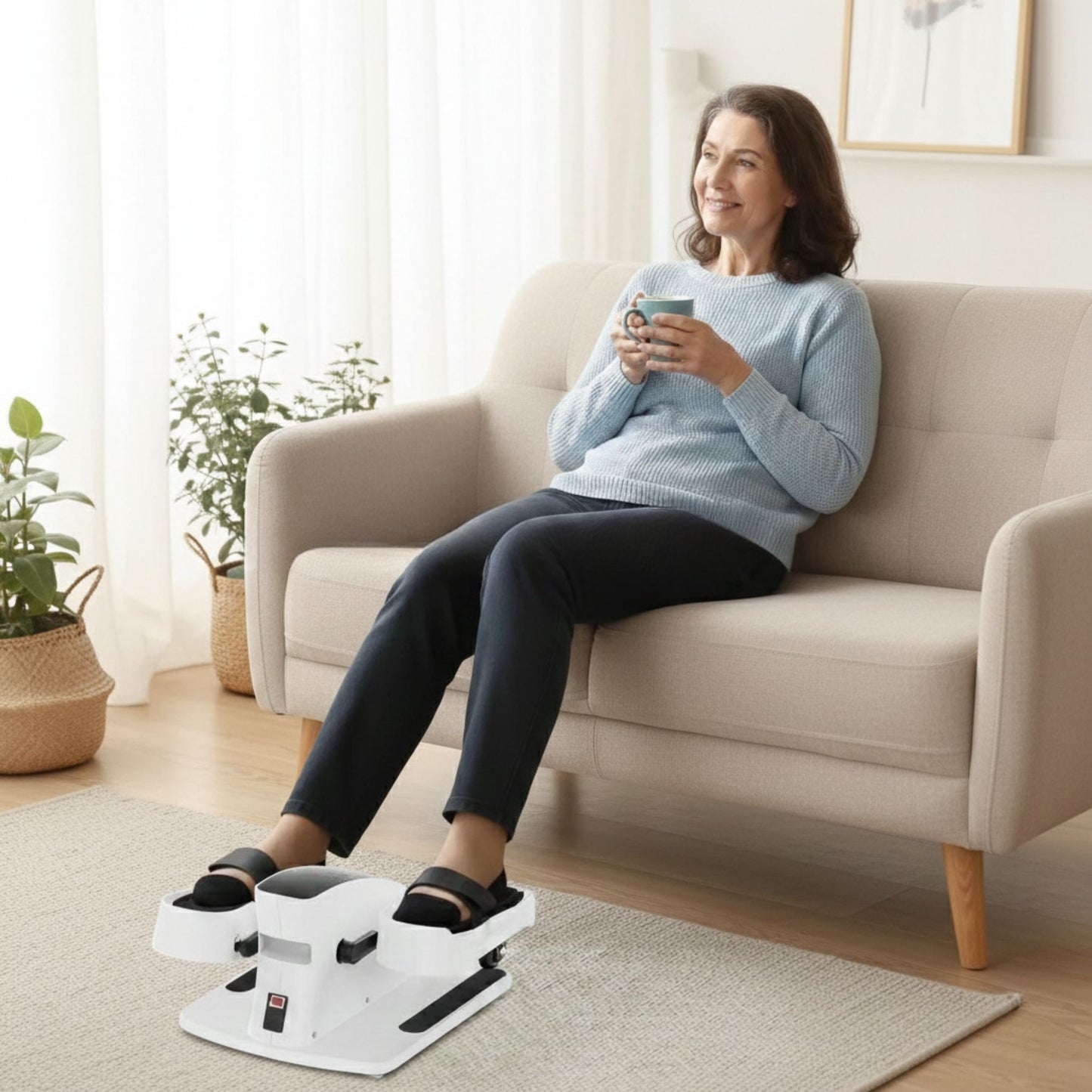 Senior woman sitting on a sofa using an electric foot massager to relax tired feet at home