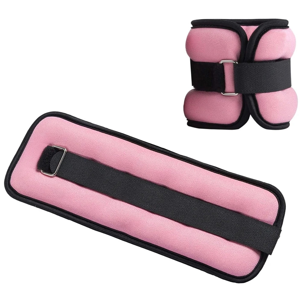 Adjustable pink ankle weights laid flat on a white background showing soft padding, secure strap and buckle, 1 lb each pair for walking and light exercise