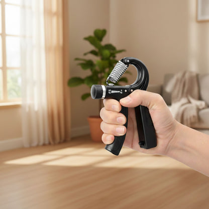 Hand holding an adjustable hand grip comfort exerciser in a calm home setting