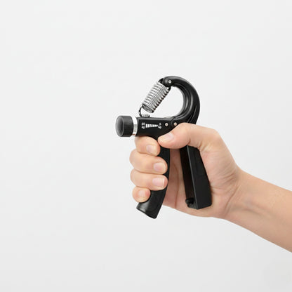 Adjustable hand grip comfort exerciser held in one hand, designed for gentle daily hand use