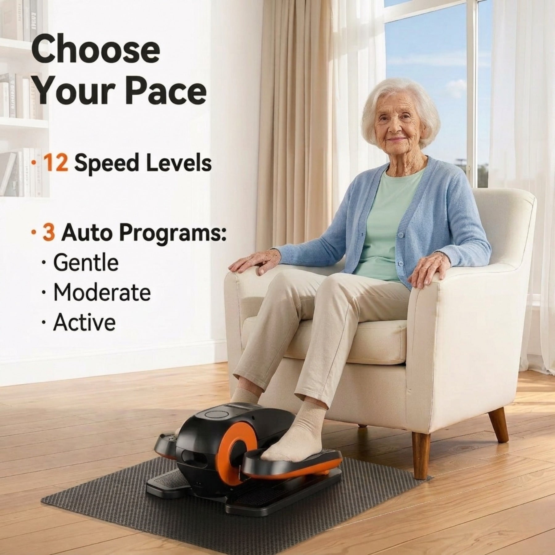 ⁠Elderly woman sitting comfortably in an armchair while using a compact under-desk elliptical exerciser with speed levels and auto programs.⁠