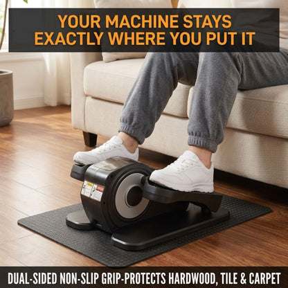 Senior woman using under-desk elliptical on non-slip mat over hardwood floor