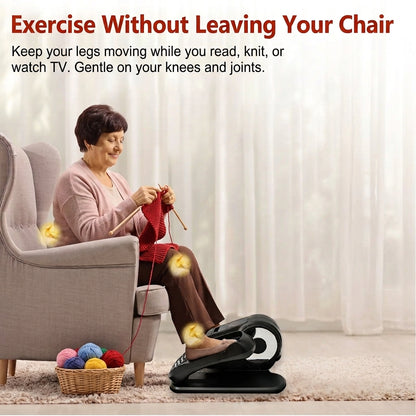 Senior woman sitting comfortably in an armchair knitting while using an electric seated leg exerciser and mini elliptical for low impact joint relief.