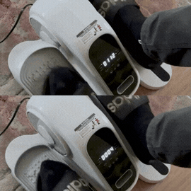 Close up of an under-desk elliptical trainer showing bi-directional forward and backward pedaling motion.
