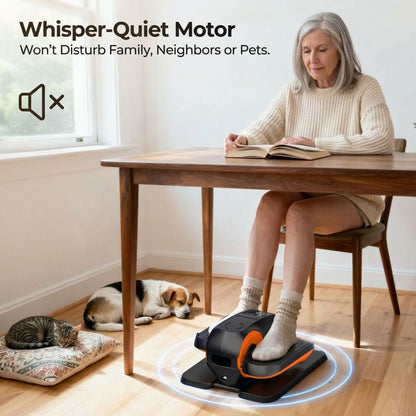 Senior woman sitting at a table reading a book while using a silent under-desk elliptical machine, featuring text overlay Whisper-Quiet Motor Won't Disturb Family, Neighbors or Pets with sleeping pets nearby.⁠